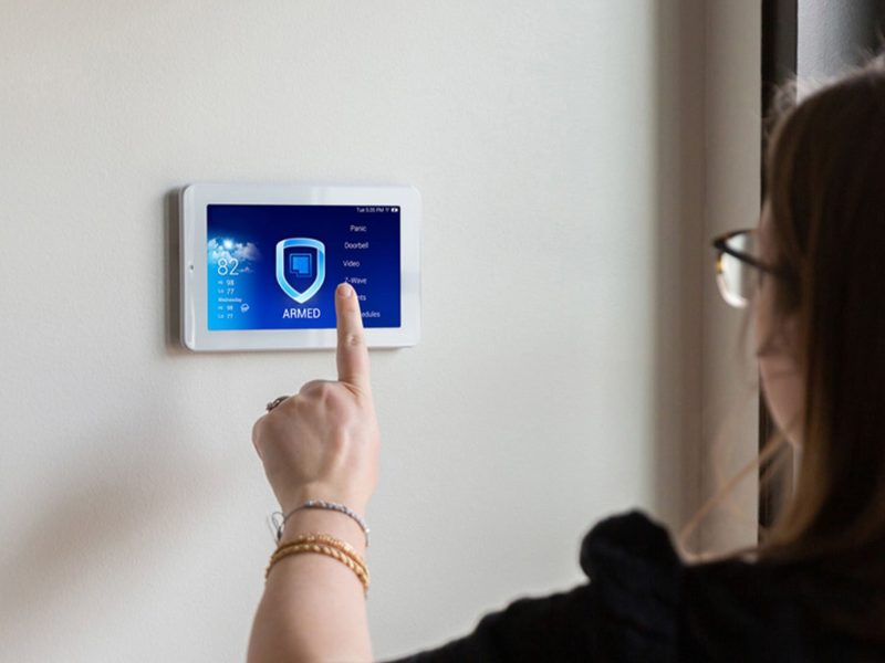Commercial burglar alarm keypad by an entry door