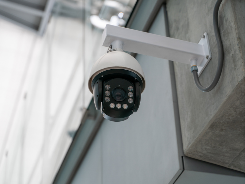 Commercial security camera being installed on a San Antonio building