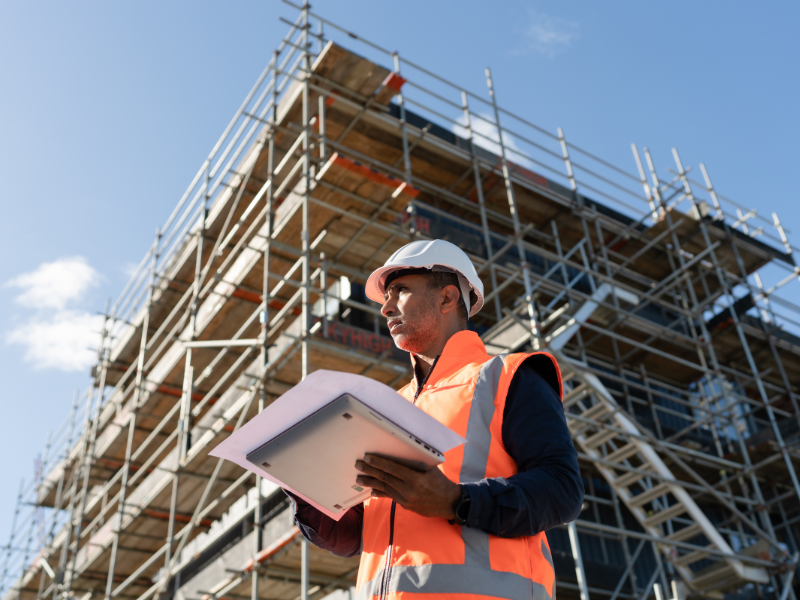 Project manager reviewing plans on a construction site